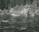 Ojibway man canoeing
