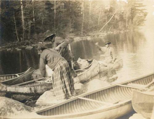 "Indians at portage between Fall and Basswood Lakes"