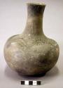 Ceramic complete vessel, long neck, three-line punctate design around shoulder