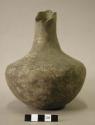 Ceramic vessel, long neck, lip partially broken off,