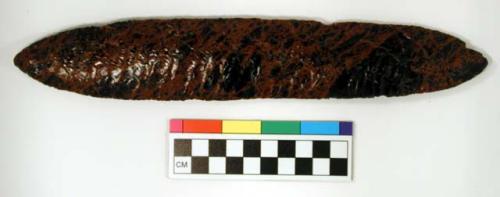 Chipped implement, red & black mottled obsidian