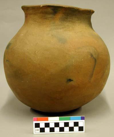 Ceramic vessel, flared neck, rounded base, micaceous slip.