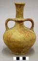 Ceramic vessel, long slim neck, 2 handles, flat base.