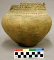Ceramic vessel, engraved rim, short neck, conical body, flat base