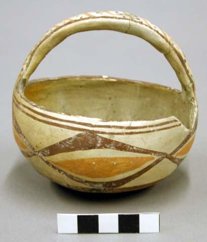 Polychrome pottery basket-shaped bowl - red, yellow, brown