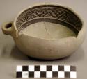 Ceramic bowl, 1 handle, black on white interior, mended