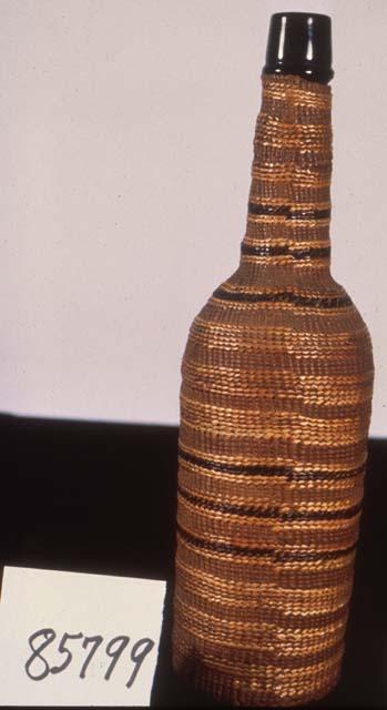 Bottle covered with basket work