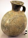 Pottery jar, handle on side, black, incised ornament