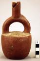 Red pottery jar, mouth on hollow handle