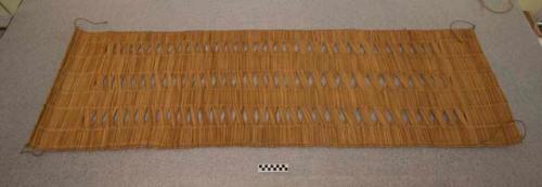 Mat of river reeds - used generally as sleeping mat, also as curtain, etc.