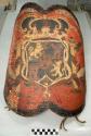 Leather shield with painted coat of arms