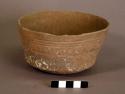 Ceramic, earthenware complete vessel, bowl, perforated rattle base, incised rim