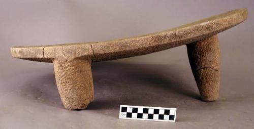 Large three-legged stone metate (restored)