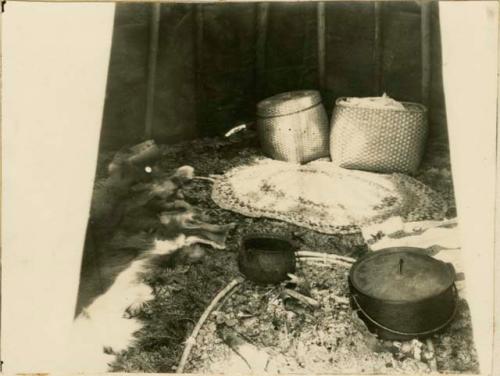 Detail of interior showing central fireplace and floor of wigwam