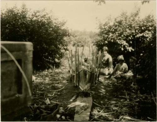 Basil Partridge making a canoe