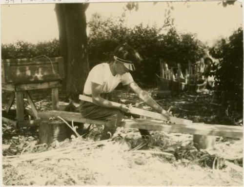 Basil Partridge making a canoe