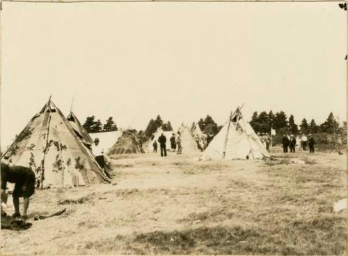 Bark and tarpaper wigwams -- taken at the Micmac mission held on Corpus Christi Day