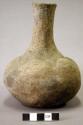 Ceramic vessel, long neck, flared lip, scalloped and