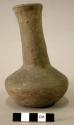 Ceramic vessel, long neck, slightly flared at lip, flat base.