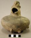 Ceramic vessel, hooded effigy human head with applied form of human body with he