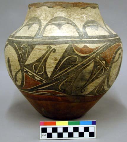 Pottery olla. Red ware with cream slip decorated with red and black