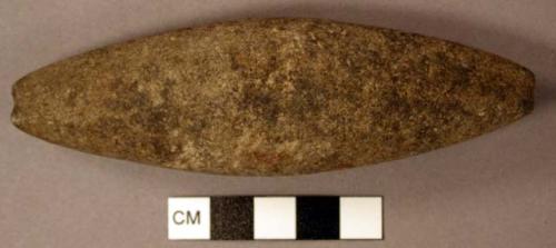 Stone pendant; encircled by shallow groove