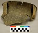 Ceramic, earthenware rim and handle sherd, two handles, flared rim, incised rim above handles, undecorated body, shell-tempered