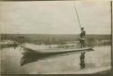 Wilson Cypress poling a canoe