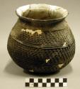 Ceramic jar, corrugated, flared rim, mended, reconstructed