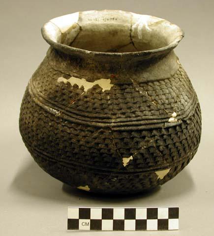 Ceramic jar, corrugated, flared rim, mended, reconstructed