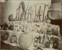 Various artifacts including: rifles, powder horns, locks, stirrups, ceramic vessles