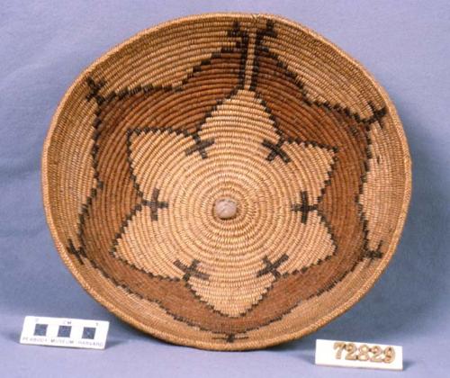 Basket with lily pattern. Cornmeal embedded in it