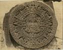 Aztec calendar stone. Top view. Carved.