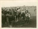 Group of Navajo people on horseback