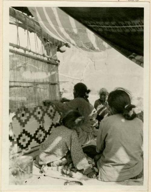 Navajo woman weaving