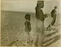 Two Navajo men and a child