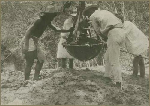 Men working at the cenote at Chichen Itza
