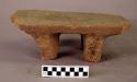 Small four-legged stone metate