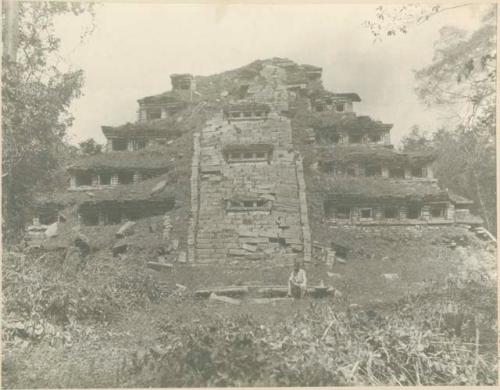 Man seated at east facade of temple near Papantla, Mexico