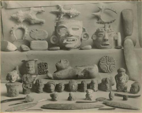 Group of flint, stone, and ceramic figures and implements