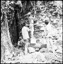 Mason working on wall of Structure 33 at Yaxchilan