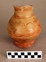 Pottery jar with ring base and red painted decoration