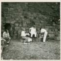 Richardson, Tozzer, and Kidder resting on the steps of a ruin