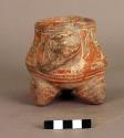 Tripod pottery urn with adorno