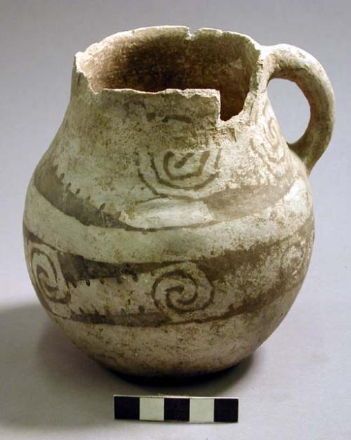 Black on white pottery jug