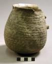 Corrugated pottery handled jar
