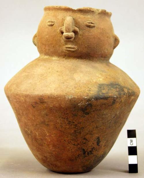 Jar, human face at neck