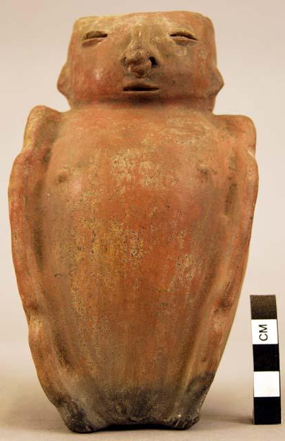 Terra cotta vase, grotesque human form