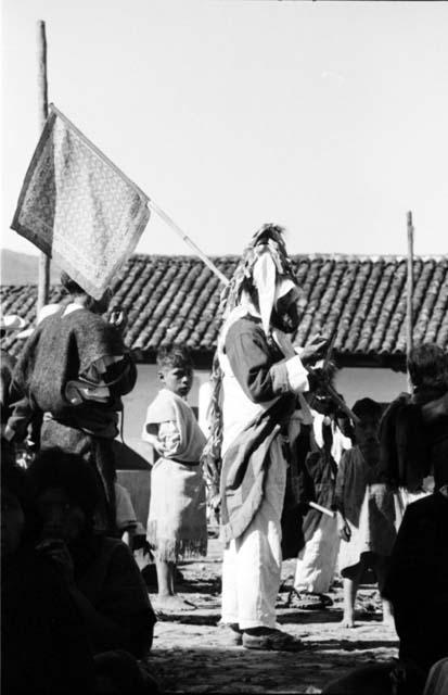 Man with flag, and boy