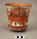 Vase painted in polychrome with a masked "anthropomorphic mythical being"